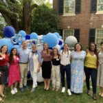 Doug Mackenzie and Dean Terry Rhodes (third and fourth from left) spent time with students at a fellowship gathering in fall 2020.