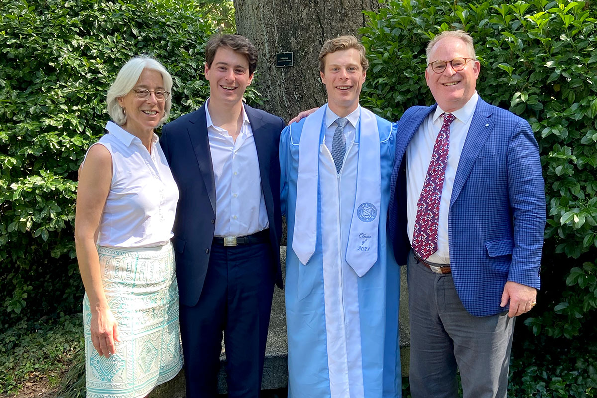 The Batchelder family pose in front of the Davie Poplar after Will’s graduation. (From left: Peggy, Teddy ’20, Will ’21 and Richard ’84)