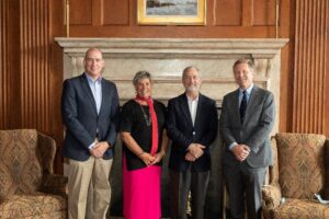 From left: Jason Mihalik; Terry Rhodes, then dean of the College of Arts and Sciences; Dr. James Kelly, executive director, Marcus Institute for Brain Health; and Chancellor Kevin Guskiewicz.